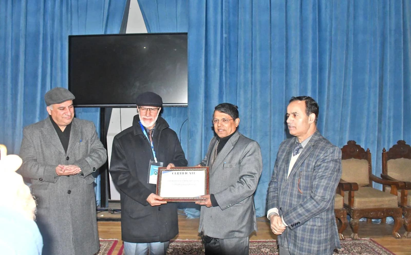 Dr. Mushtaq Ahmad Margoob receiving recognition during an academic programme